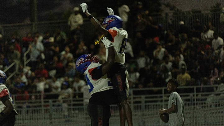 Gardena Serra players Khary Wilder and Duvay Williams celebrate a touchdown against Hamilton High