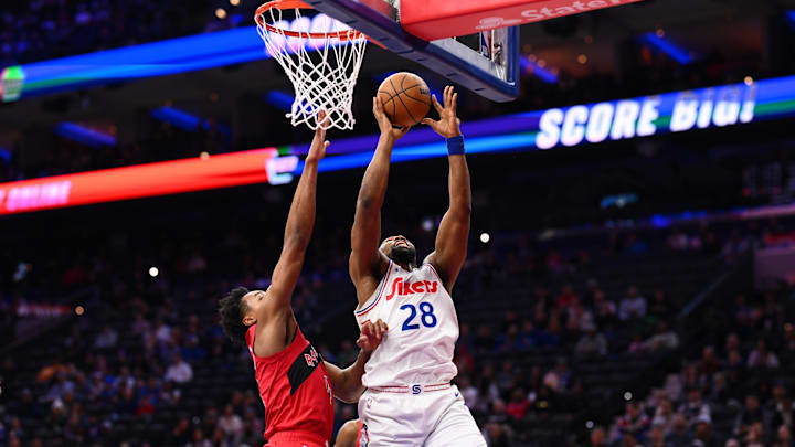 Feb 11, 2025; Philadelphia, Pennsylvania, USA; Philadelphia 76ers forward Guerschon Yabusele (28) drives to shoot against Toronto Raptors forward Scottie Barnes (4) in the second quarter at Wells Fargo Center. Mandatory Credit: Kyle Ross-Imagn Images