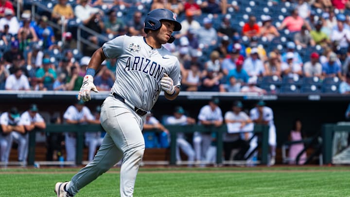 Jun 13, 2025; Omaha, Neb, USA; Arizona Wildcats catcher Adonys Guzman (18) runs to first after a single against the Coastal Carolina Chanticleers during the first inning at Charles Schwab Field. Mandatory Credit: Dylan Widger-Imagn Images Jun 13, 2025; Omaha, Neb, USA; Arizona Wildcats catcher Adonys Guzman (18) runs to first after a single against the Coastal Carolina Chanticleers during the first inning at Charles Schwab Field. Mandatory Credit: Dylan Widger-Imagn Images