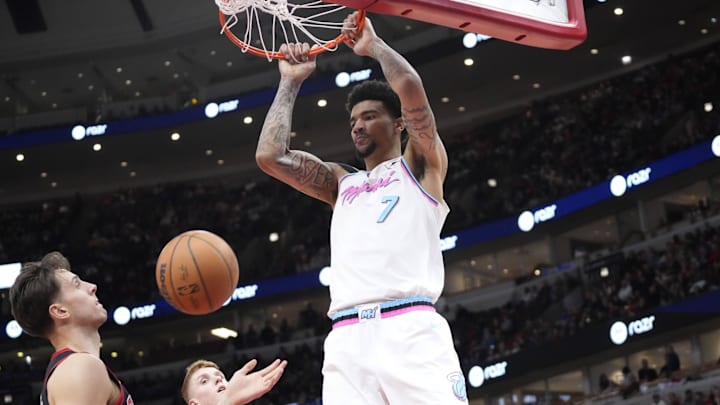 Apr 9, 2025; Chicago, Illinois, USA; Miami Heat center Kel'el Ware (7) dunks against Chicago Bulls forward Zach Collins (12) during the second half at United Center. Mandatory Credit: David Banks-Imagn Images Apr 9, 2025; Chicago, Illinois, USA; Miami Heat center Kel'el Ware (7) dunks against Chicago Bulls forward Zach Collins (12) during the second half at United Center. Mandatory Credit: David Banks-Imagn Images