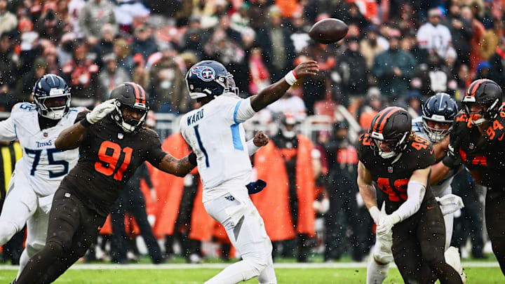 Dec 7, 2025; Cleveland, Ohio, USA; Tennessee Titans quarterback Cam Ward (1) throws a pass against Cleveland Browns defensive end Alex Wright (91) and linebacker Carson Schwesinger (49) during the second quarter at Huntington Bank Field. Mandatory Credit: Ken Blaze-Imagn Images Dec 7, 2025; Cleveland, Ohio, USA; Tennessee Titans quarterback Cam Ward (1) throws a pass against Cleveland Browns defensive end Alex Wright (91) and linebacker Carson Schwesinger (49) during the second quarter at Huntington Bank Field. Mandatory Credit: Ken Blaze-Imagn Images