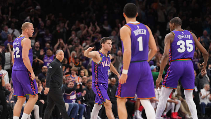 Mar 4, 2025; Phoenix, Arizona, USA; Phoenix Suns guard Collin Gillespie (12) reacts against the LA Clippers during the second half at PHX Center. Mandatory Credit: Joe Camporeale-Imagn Images