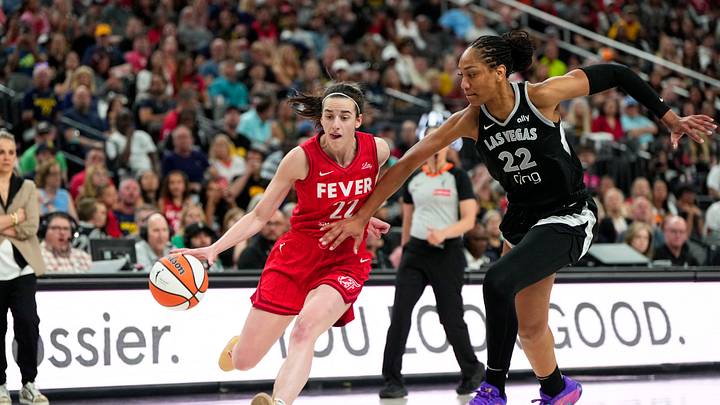 Jun 22, 2025; Las Vegas, Nevada, USA; Indiana Fever guard Caitlin Clark (22) dribbles the ball against Las Vegas Aces center A'ja Wilson (22) during the second half of a WNBA basketball game at T-Mobile Arena. Mandatory Credit: Lucas Peltier-Imagn Images Jun 22, 2025; Las Vegas, Nevada, USA; Indiana Fever guard Caitlin Clark (22) dribbles the ball against Las Vegas Aces center A'ja Wilson (22) during the second half of a WNBA basketball game at T-Mobile Arena. Mandatory Credit: Lucas Peltier-Imagn Images