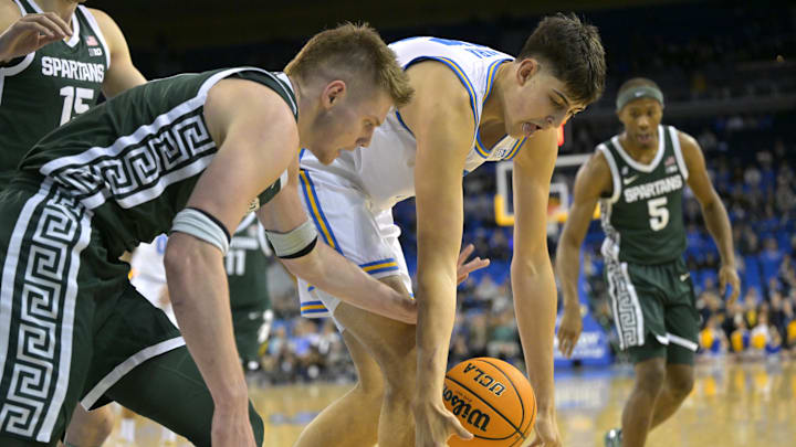 Feb 4, 2025; Los Angeles, California, USA; Michigan State Spartans forward Jaxon Kohler (0) and UCLA Bruins center Aday Mara (15) reach for a loose ball in the first half at Pauley Pavilion presented by Wescom. Mandatory Credit: Jayne Kamin-Oncea-Imagn Images Feb 4, 2025; Los Angeles, California, USA; Michigan State Spartans forward Jaxon Kohler (0) and UCLA Bruins center Aday Mara (15) reach for a loose ball in the first half at Pauley Pavilion presented by Wescom. Mandatory Credit: Jayne Kamin-Oncea-Imagn Images