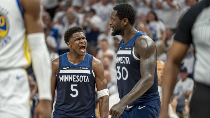 May 14, 2025; Minneapolis, Minnesota, USA; Minnesota Timberwolves guard Anthony Edwards (5) celebrates with Minnesota Timberwolves forward Julius Randle (30) after making a shot against the Golden State Warriors in the first half during game five of the second round for the 2025 NBA Playoffs at Target Center. Mandatory Credit: Jesse Johnson-Imagn Images
