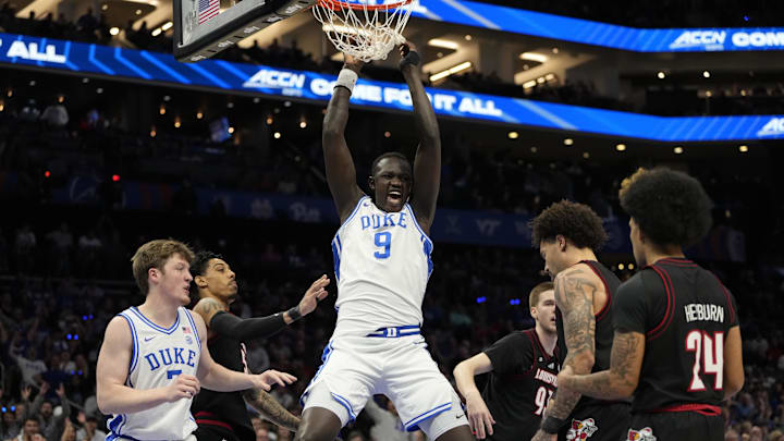 Mar 15, 2025; Charlotte, NC, USA; Duke Blue Devils center Khaman Maluach (9) reacts after a play in the first half of the 2025 ACC Conference Championship game against the Louisville Cardinals at Spectrum Center. Mandatory Credit: Bob Donnan-Imagn Images Mar 15, 2025; Charlotte, NC, USA; Duke Blue Devils center Khaman Maluach (9) reacts after a play in the first half of the 2025 ACC Conference Championship game against the Louisville Cardinals at Spectrum Center. Mandatory Credit: Bob Donnan-Imagn Images