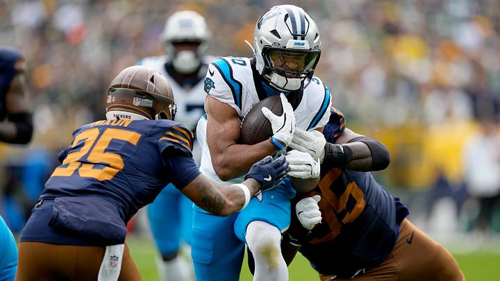 Carolina Panthers running back Chuba Hubbard (30) runs against Green Bay Packers cornerback Keisean Nixon Carolina Panthers running back Chuba Hubbard (30) runs against Green Bay Packers cornerback Keisean Nixon