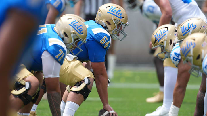 May 2, 2026; Pasadena, CA, USA; A general overall view of helmets at the line of scrimmage as UCLA Bruins center Sam Yoon (64) snaps the ball during the spring game at Rose Bowl. Mandatory Credit: Kirby Lee-Imagn Images