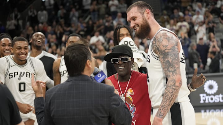  Rapper Flavor Flav congratulates San Antonio Spurs forward Sandro Mamukelashvili (54) after scoring thirty four points against the New York Knicks at Frost Bank Center. 