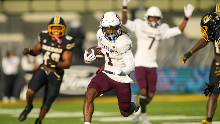 Nov 8, 2025; Columbia, Missouri, USA; Texas A&M Aggies wide receiver Mario Craver (1) runs with the ball during the first half against the Missouri Tigers at Faurot Field at Memorial Stadium. Mandatory Credit: Jay Biggerstaff-Imagn Images