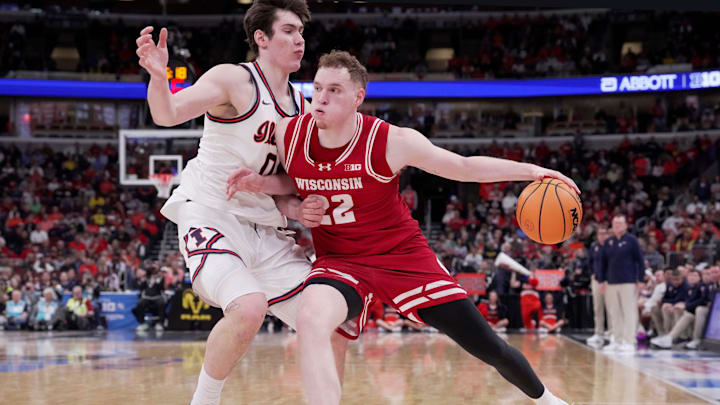 Illinois forward David Mirkovic (0) guards Wisconsin forward Austin Rapp (22) during the second half of their quarterfinal game in the Big Ten tournament Friday, March 13, 2026 at the United Center in Chicago, Illinois. Wisconsin beat Illinois 91-88.