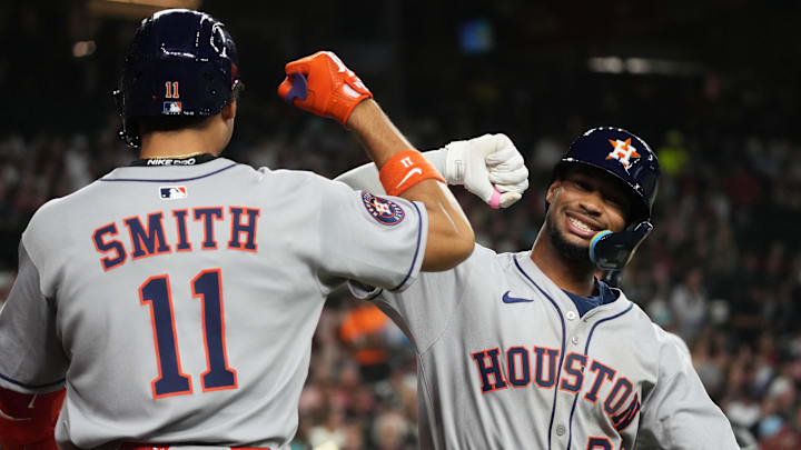 Jul 21, 2025; Phoenix, Arizona, USA; Houston Astros shortstop Brice Matthews (28) celebrates with outfielder Cam Smith (11) after hitting a three run home run against Zac Gallen and the Arizona Diamondbacks in the second inning at Chase Field. Mandatory Credit: Rick Scuteri-Imagn Images