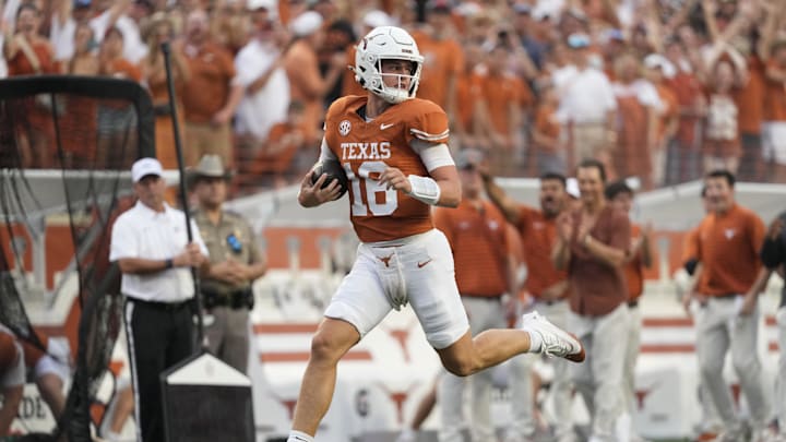Sep 14, 2024; Austin, Texas, USA; Texas Longhorns quarterback Arch Manning (16) runs for a touchdown during the first half against the Texas-San Antonio Roadrunners at Darrell K Royal-Texas Memorial Stadium. Mandatory Credit: Scott Wachter-Imagn Images