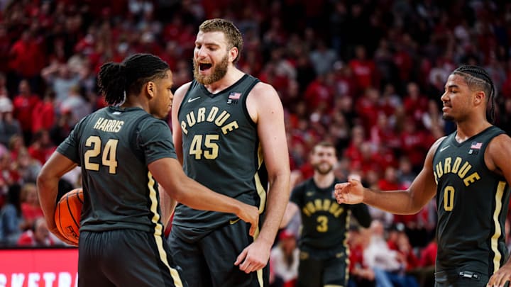 Purdue Boilermakers guard Gicarri Harris (24), center Oscar Cluff (45) and guard C.J. Cox (0) 