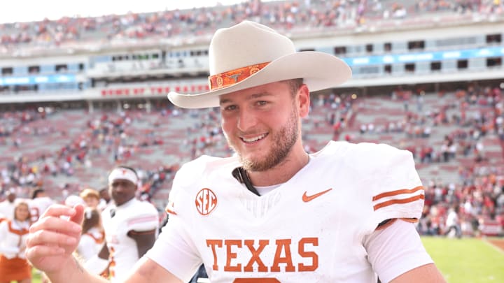 Nov 16, 2024; Fayetteville, Arkansas, USA; Texas Longhorns quarterback Quinn Ewers (3) celebrates after the game against the Arkansas Razorbacks at Donald W. Reynolds Razorback Stadium. Texas won 20-10. Mandatory Credit: Nelson Chenault-Imagn Images