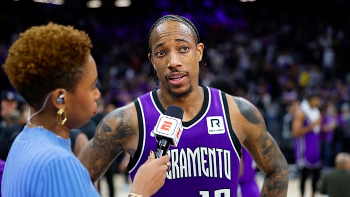 Jan 22, 2025; Sacramento, California, USA; Sacramento Kings forward DeMar DeRozan (10) is interviewed by the media after the game against the Golden State Warriors at Golden 1 Center. Mandatory Credit: Sergio Estrada-Imagn Images