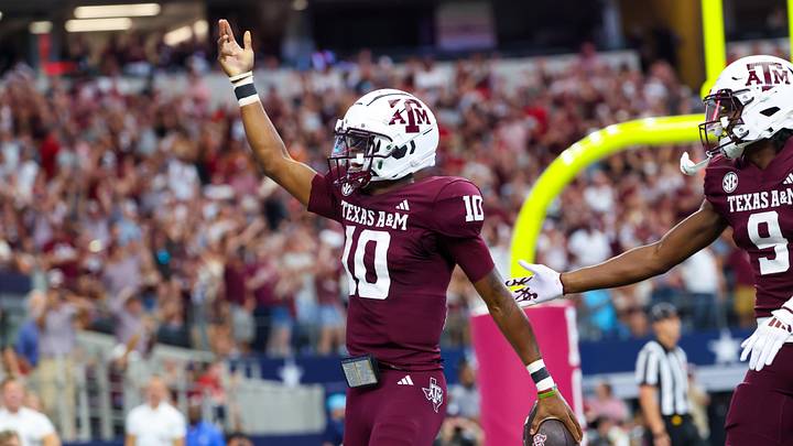 Texas A&M Aggies quarterback Marcel Reed reacts after scoring a touchdown during the first half against the Arkansas Razorbacks at AT&T Stadium.