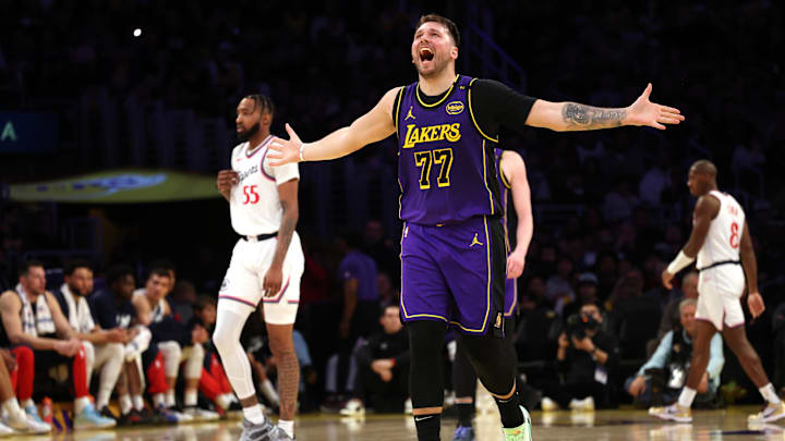 Feb 28, 2025; Los Angeles, California, USA; Los Angeles Lakers guard Luka Doncic (77) reacts after a play during the second quarter against the LA Clippers at Crypto.com Arena. Mandatory Credit: Jason Parkhurst-Imagn Images Feb 28, 2025; Los Angeles, California, USA; Los Angeles Lakers guard Luka Doncic (77) reacts after a play during the second quarter against the LA Clippers at Crypto.com Arena. Mandatory Credit: Jason Parkhurst-Imagn Images
