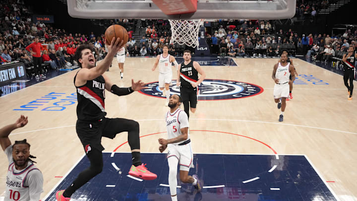 Mar 31, 2026; Inglewood, California, USA; Portland Trail Blazers forward Deni Avdija (8) shoots the ball against LA Clippers guard Darius Garland (10) and forward Derrick Jones Jr. (5) in the second half at Intuit Dome. Mandatory Credit: Kirby Lee-Imagn Images