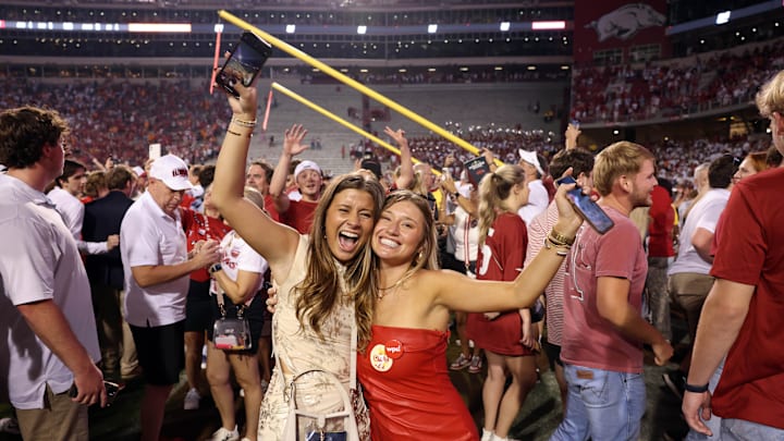 Arkansas Razorbacks fans celebrate in front of the downed goal posts after the game against the Tennessee Volunteers at Donald W. Reynolds Razorback Stadium. Arkansas won 19-14. 