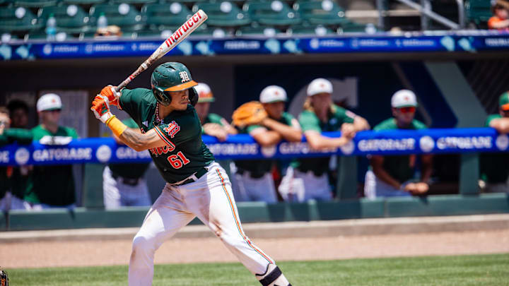 May 23, 2024; Charlotte, NC, USA; Miami (Fl) Hurricanes catcher Carlos Perez (61) at bat against the Clemson Tigers in the third inning during the ACC Baseball Tournament at Truist Field. Mandatory Credit: Scott Kinser-Imagn Images