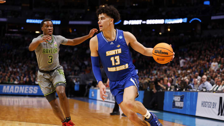 Mar 17, 2023; Denver, CO, USA;  UC Santa Barbara Gauchos guard Ajay Mitchell (13) drives to the basket against Baylor Bears guard Dale Bonner (3) during the first half in the first round of the 2023 NCAA men   s basketball tournament at Ball Arena. Mandatory Credit: Michael Ciaglo-USA TODAY Sports