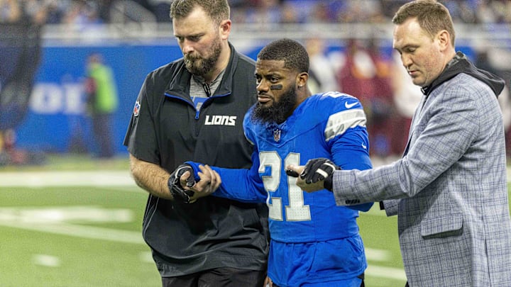 Jan 18, 2025; Detroit, Michigan, USA; Detroit Lions corner back Amik Robertson (21) walks off the field assisted by trainers during the first quarter against the Washington Commanders at Ford Field. Mandatory Credit: David Reginek-Imagn Images Jan 18, 2025; Detroit, Michigan, USA; Detroit Lions corner back Amik Robertson (21) walks off the field assisted by trainers during the first quarter against the Washington Commanders at Ford Field. Mandatory Credit: David Reginek-Imagn Images
