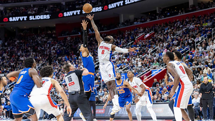 Apr 27, 2025; Detroit, Michigan, USA; Detroit Pistons forward Tim Hardaway Jr. (8) has a jump ball against New York Knicks guard Josh Hart (3) during the second quarter of game four of first round for the 2025 NBA Playoffs at Little Caesars Arena. Mandatory Credit: David Reginek-Imagn Images