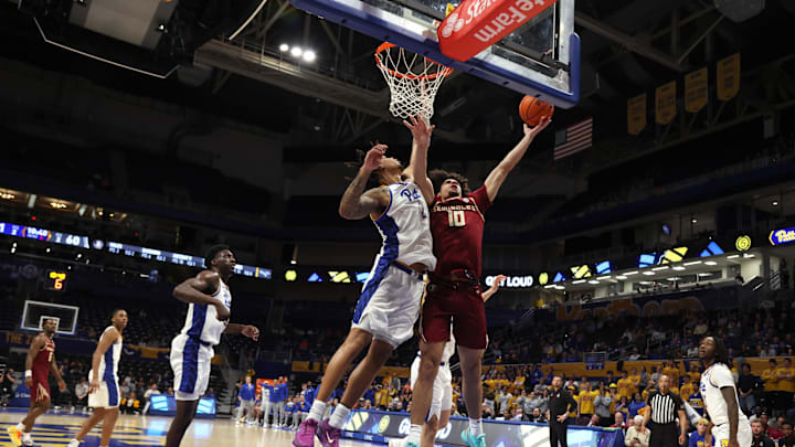 Mar 4, 2026; Pittsburgh, Pennsylvania, USA;  Florida State Seminoles guard Lajae Jones (10) goes to the basket against Pittsburgh Panthers forward Cameron Corhen (2) during the second half at the Petersen Events Center. Mandatory Credit: Charles LeClaire-Imagn Images