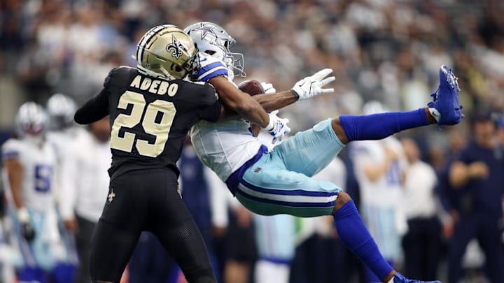 Sep 15, 2024; Arlington, Texas, USA; Dallas Cowboys wide receiver Jalen Tolbert (1) catches a pass against New Orleans Saints cornerback Paulson Adebo (29) in the second half at AT&T Stadium. Mandatory Credit: Tim Heitman-Imagn Images