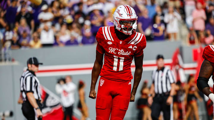 Aug 28, 2025; Raleigh, North Carolina, USA; North Carolina State Wolfpack quarterback CJ Bailey (11) celebrates a touchdown during the first half of the game against East Carolina Pirates at Carter-Finley Stadium. Mandatory Credit: Jaylynn Nash-Imagn Images Aug 28, 2025; Raleigh, North Carolina, USA; North Carolina State Wolfpack quarterback CJ Bailey (11) celebrates a touchdown during the first half of the game against East Carolina Pirates at Carter-Finley Stadium. Mandatory Credit: Jaylynn Nash-Imagn Images