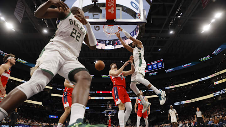 Nov 20, 2023; Washington, District of Columbia, USA; Milwaukee Bucks forward Giannis Antetokounmpo (34) dunks the ball as Washington Wizards forward Deni Avdija (8) and Bucks forward Khris Middleton (22) look on in the second quarter at Capital One Arena. Mandatory Credit: Geoff Burke-Imagn Images Nov 20, 2023; Washington, District of Columbia, USA; Milwaukee Bucks forward Giannis Antetokounmpo (34) dunks the ball as Washington Wizards forward Deni Avdija (8) and Bucks forward Khris Middleton (22) look on in the second quarter at Capital One Arena. Mandatory Credit: Geoff Burke-Imagn Images