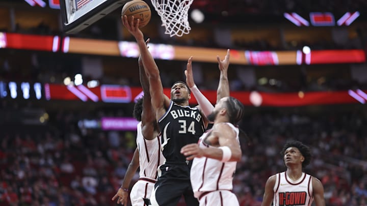 Feb 25, 2025; Houston, Texas, USA; Milwaukee Bucks forward Giannis Antetokounmpo (34) shoots the ball as Houston Rockets forward Dillon Brooks (9) defends during the third quarter at Toyota Center. Mandatory Credit: Troy Taormina-Imagn Images