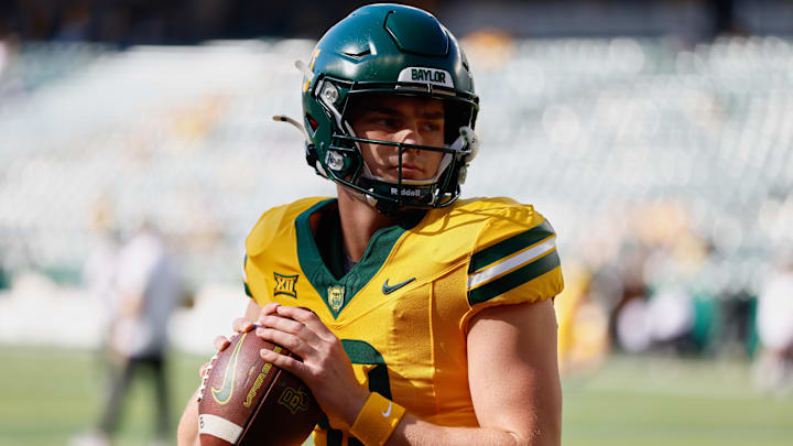 Oct 4, 2025; Waco, Texas, USA; Baylor Bears quarterback Sawyer Robertson (13) warms up before the game against the Kansas State Wildcats at McLane Stadium. Mandatory Credit: Chris Jones-Imagn Images