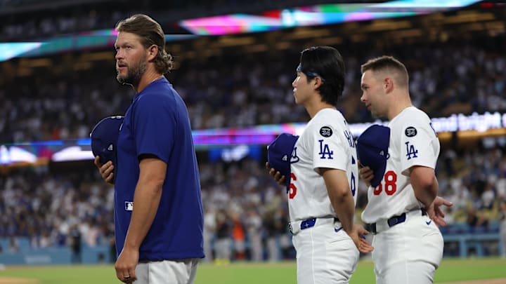 Sep 18, 2025; Los Angeles, California, USA;  Los Angeles Dodgers pitcher Clayton Kershaw (22) and second base Hyeseong Kim (6) and catcher Dalton Rushing (68) stand for the National anthem prior to the game against the San Francisco Giants at Dodger Stadium. Mandatory Credit: Kiyoshi Mio-Imagn Images