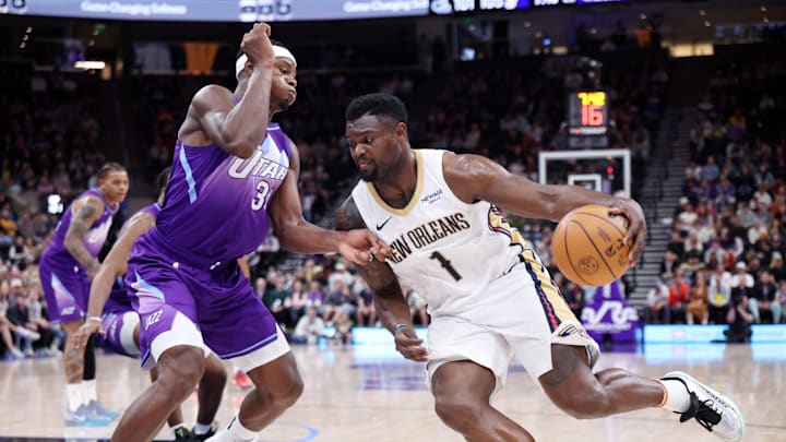 Mar 2, 2025; Salt Lake City, Utah, USA; New Orleans Pelicans forward Zion Williamson (1) drives against Utah Jazz center Oscar Tshiebwe (34) during the second half at Delta Center. Mandatory Credit: Rob Gray-Imagn Images