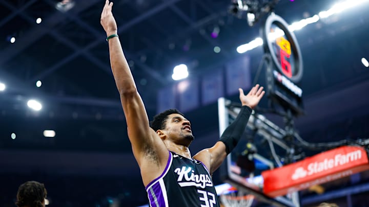 Jan 14, 2026; Sacramento, California, USA; Sacramento Kings center Dylan Cardwell (32) cheers up the crowd after a play during the second quarter against the New York Knicks at Golden 1 Center. Mandatory Credit: Sergio Estrada-Imagn Images