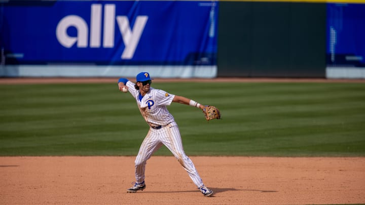 May 23, 2024; Charlotte, NC, USA; Pittsburgh Panthers infielder Ryan Zuckerman (14) field s the ground ball in the ninth inning against the North Carolina Tar Heels during the ACC Baseball Tournament at Truist Field. May 23, 2024; Charlotte, NC, USA; Pittsburgh Panthers infielder Ryan Zuckerman (14) field s the ground ball in the ninth inning against the North Carolina Tar Heels during the ACC Baseball Tournament at Truist Field.