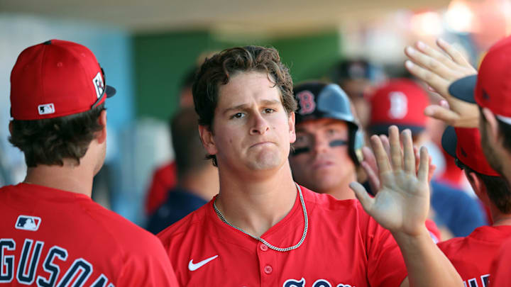 Feb 28, 2025; Clearwater, Florida, USA; Boston Red Sox outfielder Roman Anthony (48) is congratulated after he scored a run against the Philadelphia Phillies  during the third inning  at BayCare Ballpark. Mandatory Credit: Kim Klement Neitzel-Imagn Images