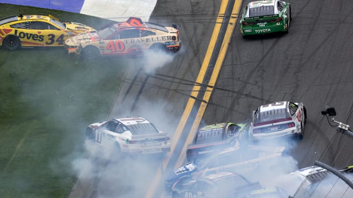 Feb 15, 2026; Daytona Beach, Florida, USA; NASCAR Cup Series drivers Justin Allgaier (40), Todd Gilliland (34), Denny Hamlin (11), Kyle Larson (5) and Alex Bowman (48) crash during the 68th running of the Daytona 500 at Daytona International Speedway.
