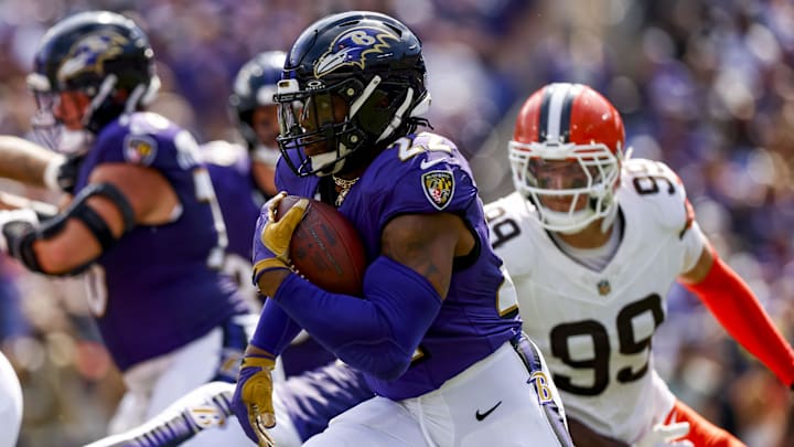 Sep 14, 2025; Baltimore, Maryland, USA; Baltimore Ravens running back Derrick Henry (22) runs the ball during the second quarter at M&T Bank Stadium. Mandatory Credit: Peter Casey-Imagn Images
