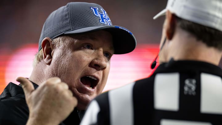 Oct 19, 2024; Gainesville, Florida, USA; Kentucky Wildcats head coach Mark Stoops argues a call with the referee against the Florida Gators during the second half at Ben Hill Griffin Stadium. Mandatory Credit: Matt Pendleton-Imagn Images