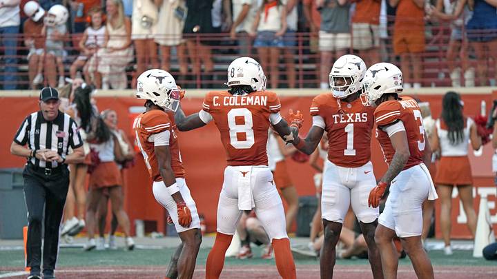 Sep 19, 2026; Austin, Texas, USA;  Texas Longhorns wide receiver Cam Coleman (8) celebrates with wide receiver Ryan Wingo (1) and teammates after scoring a touchdown during the first half against the UTSA Roadrunners at Darrell K Royal-Texas Memorial Stadium.  Mandatory Credit: Scott Wachter-Imagn Images