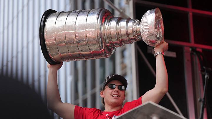 Jun 20, 2026; Raleigh, North Carolina, USA; Carolina Hurricanes defenseman Alexander Nikishin (21) holds up the Stanley Cup Trophy during the Stanley Cup championship parade and rally at Raleigh. Mandatory Credit: James Guillory-Imagn Images Jun 20, 2026; Raleigh, North Carolina, USA; Carolina Hurricanes defenseman Alexander Nikishin (21) holds up the Stanley Cup Trophy during the Stanley Cup championship parade and rally at Raleigh. Mandatory Credit: James Guillory-Imagn Images
