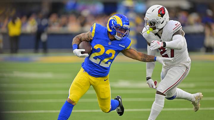 Los Angeles Rams running back Blake Corum (22) carries the ball as Arizona Cardinals linebacker Akeem Davis-Gaither (27) defends during the second half at SoFi Stadium. Los Angeles Rams running back Blake Corum (22) carries the ball as Arizona Cardinals linebacker Akeem Davis-Gaither (27) defends during the second half at SoFi Stadium.