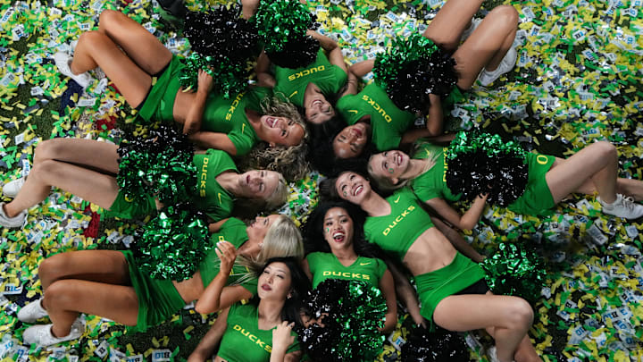 Oregon Ducks cheerleaders smile for a group photo Sunday, Dec. 8, 2024, after the Big Ten Championship game at Lucas Oil Stadium in Indianapolis. The Oregon Ducks defeated the Penn State Nittany Lions, 45-37. Oregon Ducks cheerleaders smile for a group photo Sunday, Dec. 8, 2024, after the Big Ten Championship game at Lucas Oil Stadium in Indianapolis. The Oregon Ducks defeated the Penn State Nittany Lions, 45-37.