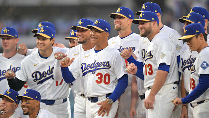 Mar 27, 2026; Los Angeles, California, USA; Los Angeles Dodgers manager Dave Roberts (30) poses with players during the World Series ring ceremony before the game against the Arizona Diamondbacks at Dodger Stadium. Mandatory Credit: Jayne Kamin-Oncea-Imagn Images