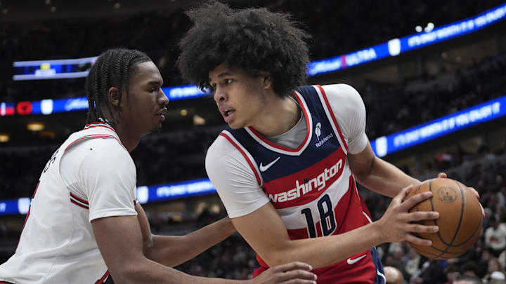 Apr 11, 2025; Chicago, Illinois, USA;Chicago Bulls forward Julian Phillips (15) defends Washington Wizards forward Kyshawn George (18) during the second half at United Center. Mandatory Credit: David Banks-Imagn Images