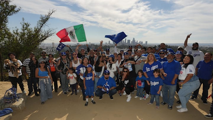 Fans celebrate overlooking Dodger Stadium and the Los Angeles skyline during the 2024 World Series championship celebration for the Los Angeles Dodgers on Nov 1.
