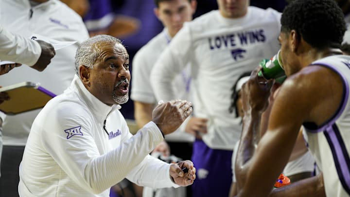 Dec 30, 2024; Manhattan, Kansas, USA; Kansas State Wildcats head coach Jerome Tang talks to players during a timeout during the second half against the Cincinnati Bearcats at Bramlage Coliseum. Mandatory Credit: Jay Biggerstaff-Imagn Images